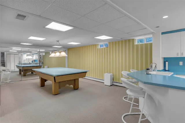 a kitchen with a sink cabinets and appliances