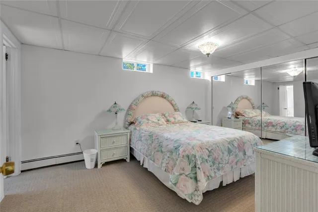 a room with table chair and white walls