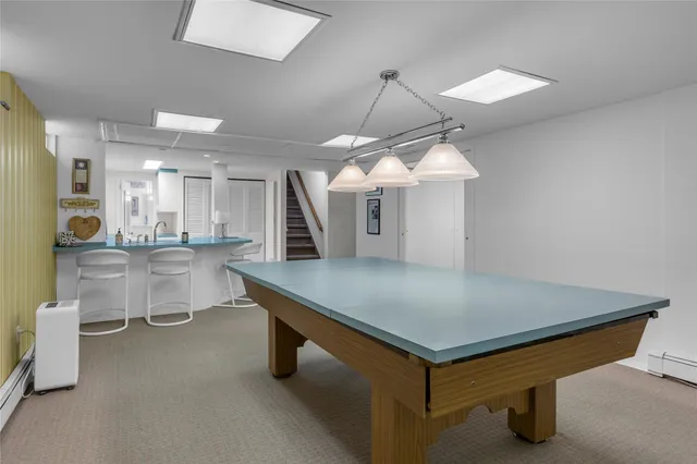 a bedroom with a bed and a chair