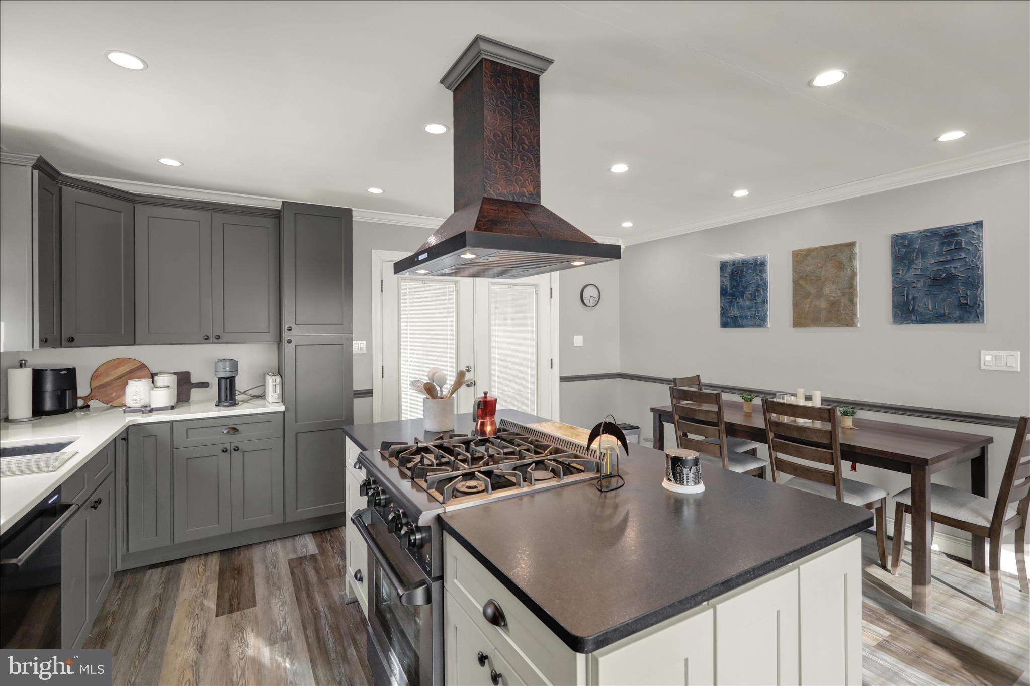 933 Philadelphia Avenue Reading, PA 19607 - Photo 12 of 34 a kitchen with a stove a sink dishwasher and a refrigerator