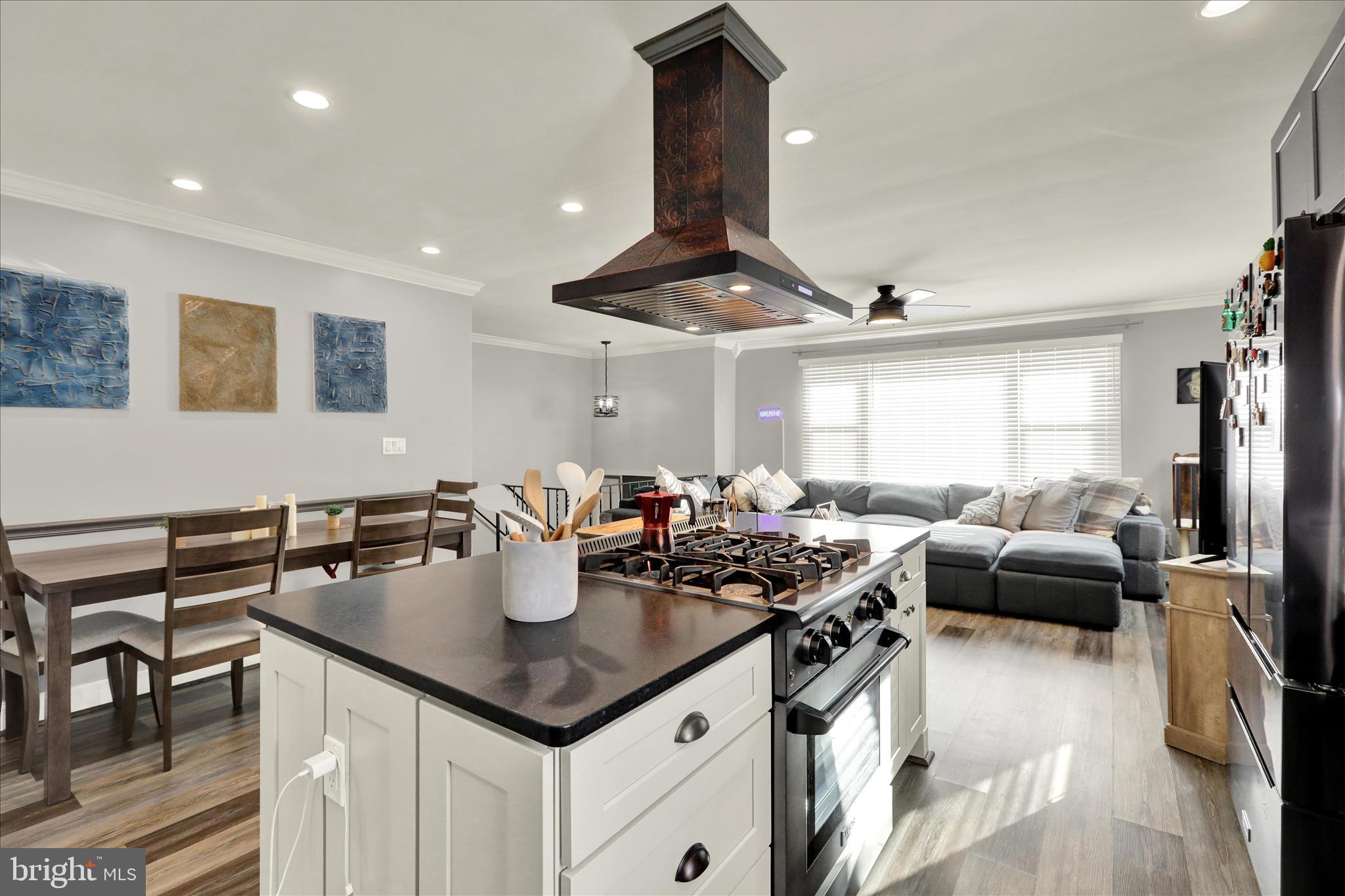 933 Philadelphia Avenue Reading, PA 19607 - Photo 14 of 34 a kitchen with stainless steel appliances granite countertop a sink a stove and a refrigerator