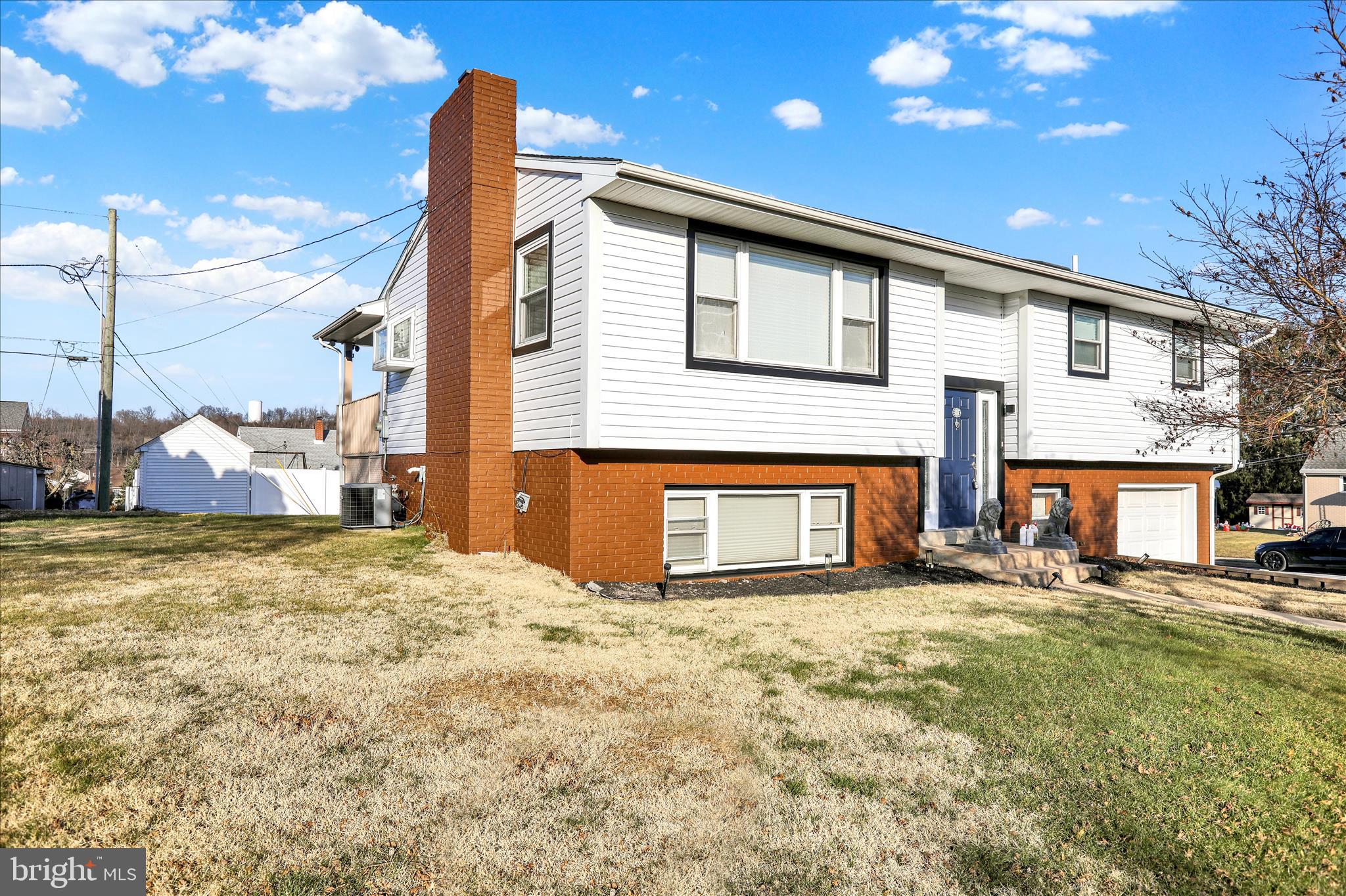 933 Philadelphia Avenue Reading, PA 19607 - Photo 28 of 34 a view of a house with a yard and garage