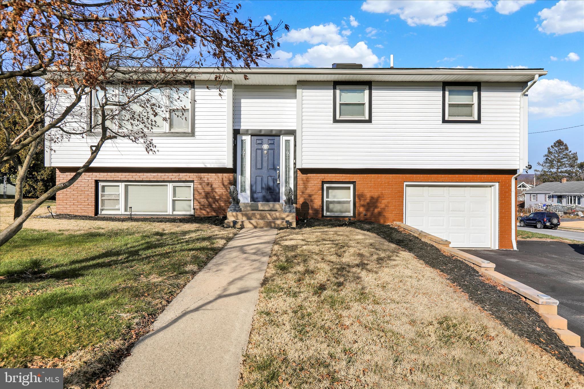 933 Philadelphia Avenue Reading, PA 19607 - Photo 4 of 34 a front view of a house with a yard