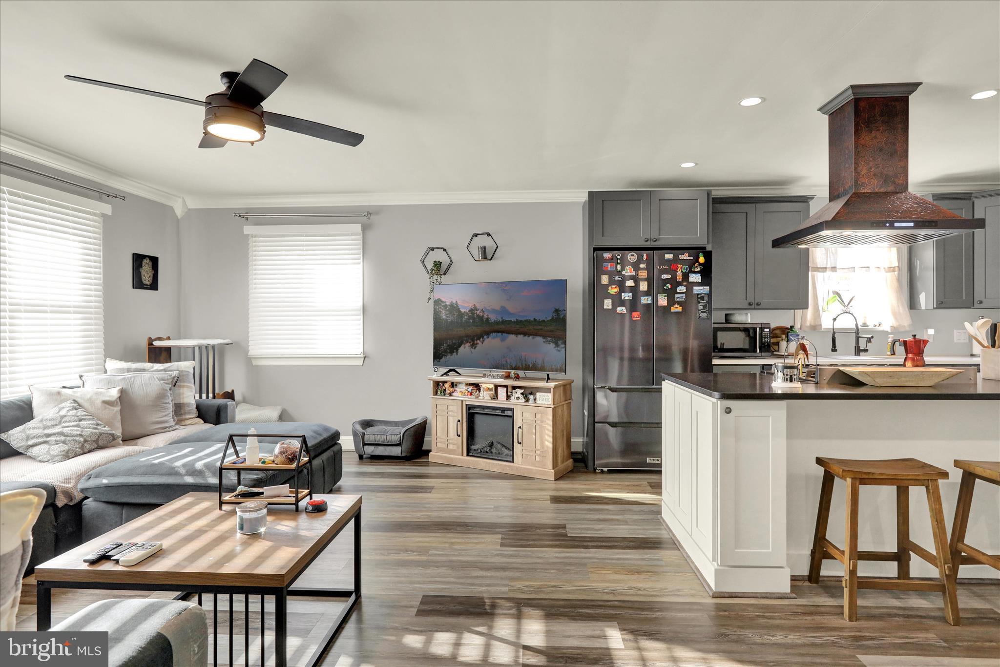 933 Philadelphia Avenue Reading, PA 19607 - Photo 8 of 34 a living room with stainless steel appliances kitchen island granite countertop furniture and a kitchen view