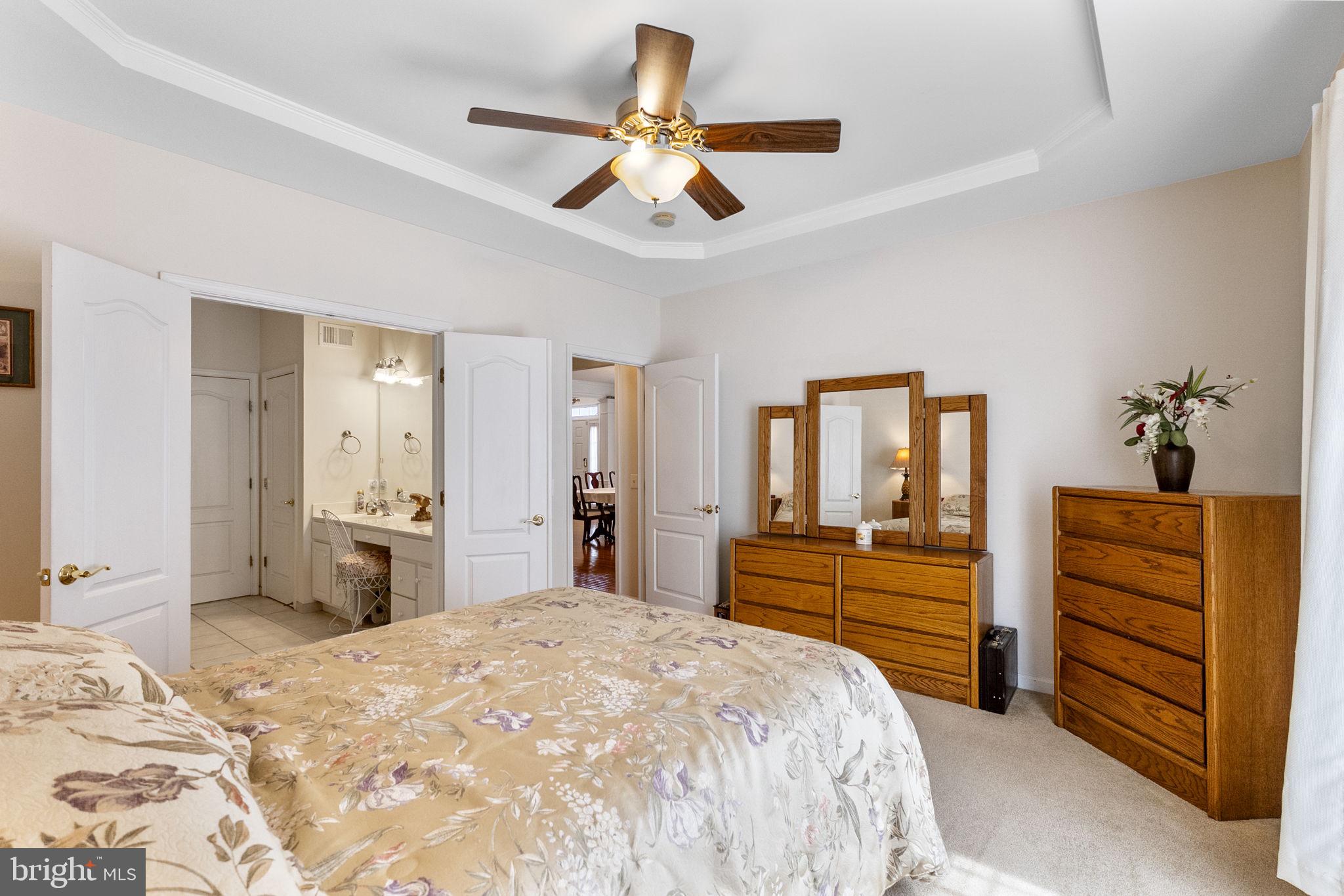 8245 Academy Road, Unit 42 Ellicott City, MD 21043 - Photo 16 of 48 Main level Primary Bedroom with ensuite