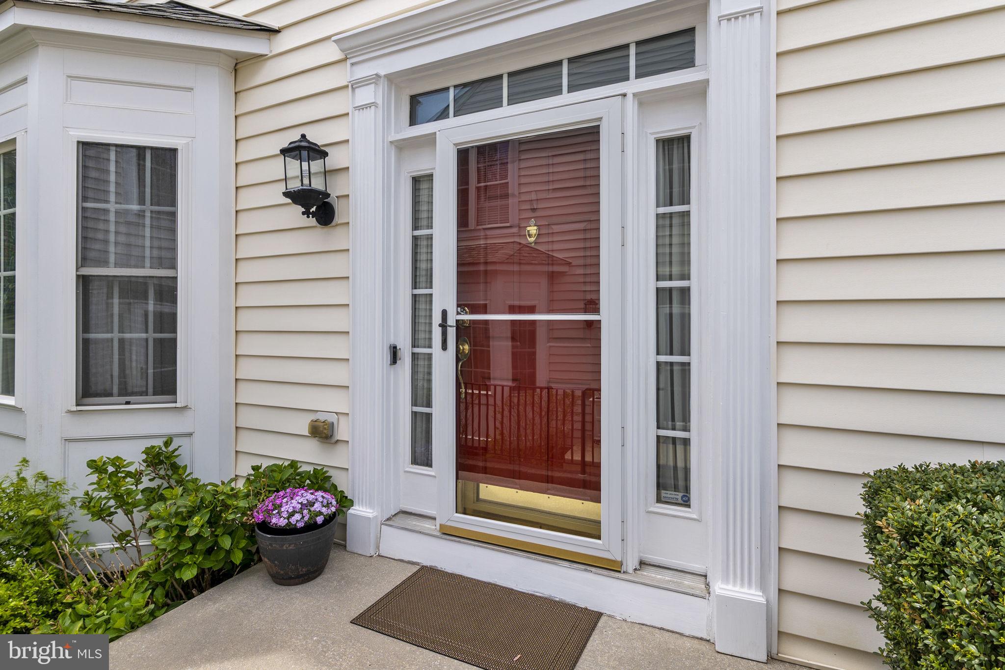 8245 Academy Road, Unit 42 Ellicott City, MD 21043 - Photo 2 of 48 walking up to front door