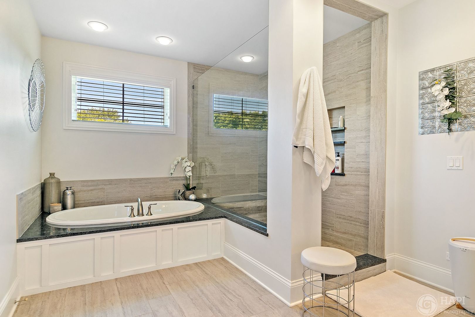 26021 West Sunset Road Barrington, IL 60010 - Photo 17 of 39 a bathroom with a tub a toilet a sink and glass door