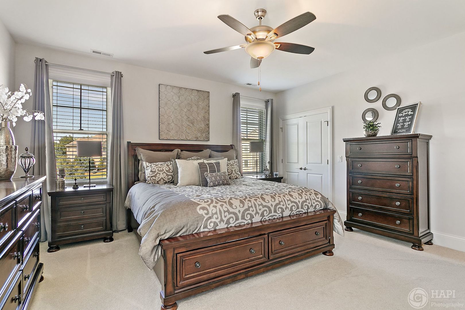 26021 West Sunset Road Barrington, IL 60010 - Photo 20 of 39 a bedroom with a bed and a chandelier