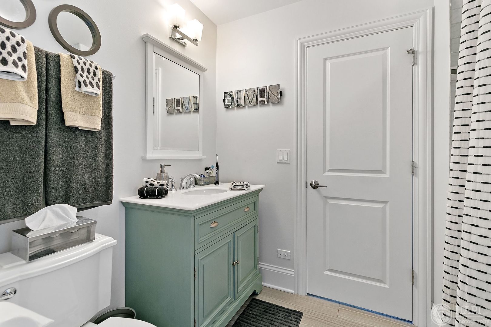 26021 West Sunset Road Barrington, IL 60010 - Photo 23 of 39 a bathroom with a sink a toilet and a mirror