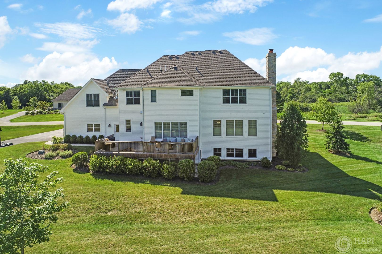 26021 West Sunset Road Barrington, IL 60010 - Photo 31 of 39 a view of a house with a yard table and chairs