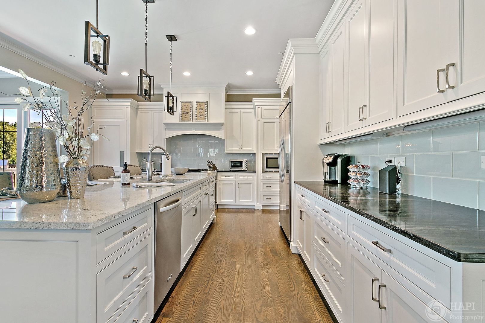 26021 West Sunset Road Barrington, IL 60010 - Photo 9 of 39 a large white kitchen with granite countertop lots of counter space white cabinets and stainless steel appliances