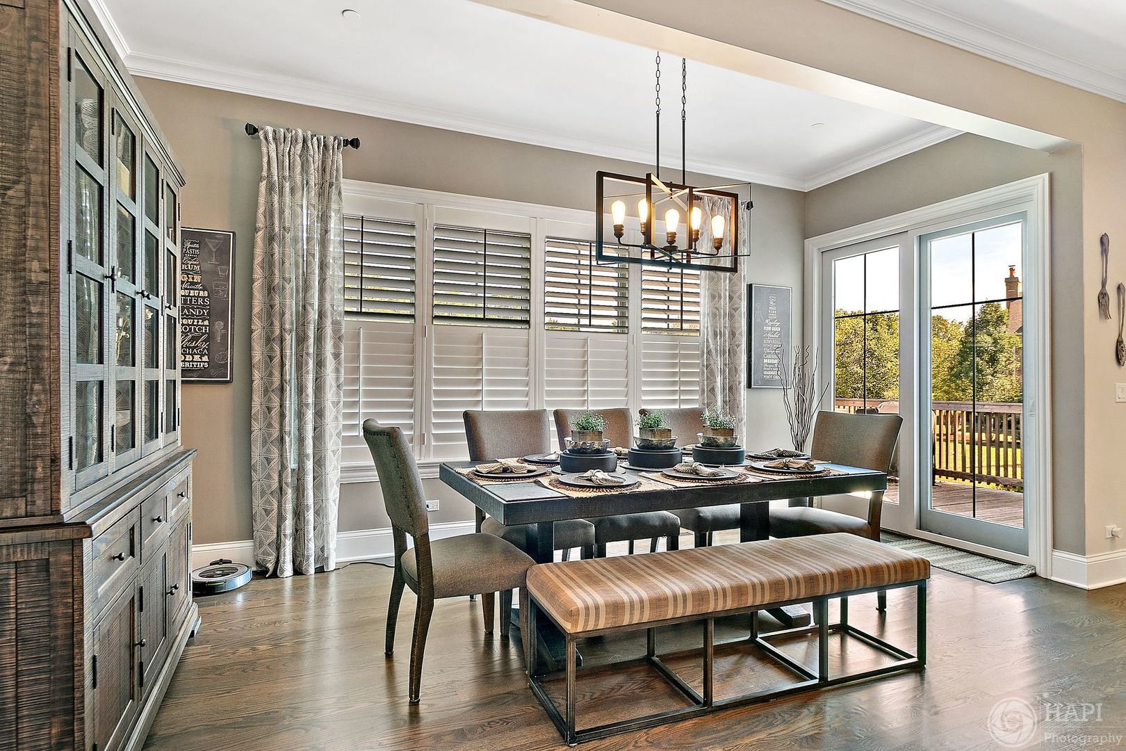 26021 West Sunset Road Barrington, IL 60010 - Photo 10 of 39 a dining room with furniture a chandelier and wooden floor