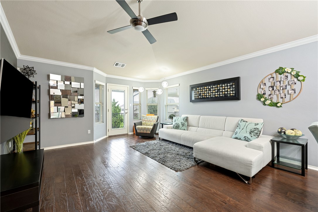 7310 Sunset Heights Circle, Unit F20 Austin, TX 78735 - Photo 13 of 32 a living room with furniture and a flat screen tv