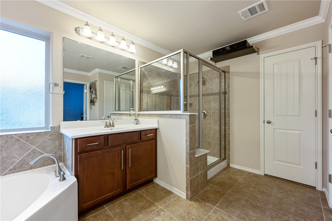 7310 Sunset Heights Circle, Unit F20 Austin, TX 78735 - Photo 21 of 32 a bathroom with a sink mirror and a shower