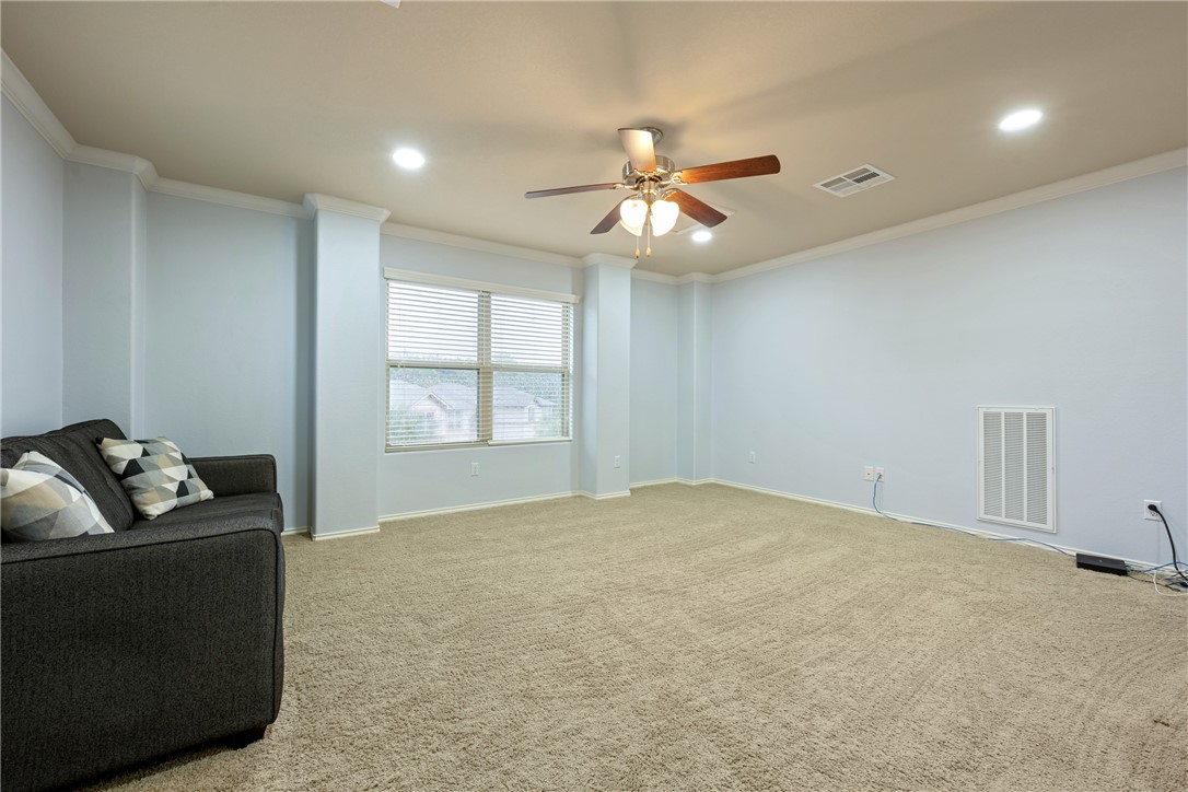 7310 Sunset Heights Circle, Unit F20 Austin, TX 78735 - Photo 25 of 32 a living room with furniture and a window