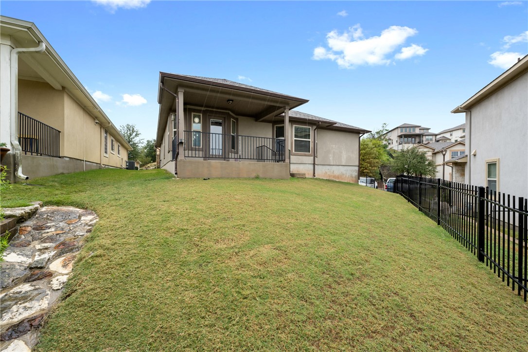 7310 Sunset Heights Circle, Unit F20 Austin, TX 78735 - Photo 27 of 32 a view of a house with backyard and porch