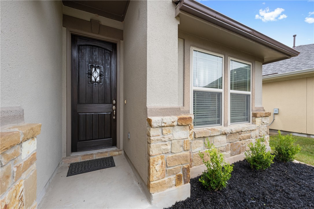 7310 Sunset Heights Circle, Unit F20 Austin, TX 78735 - Photo 3 of 32 a front view of a house with a yard