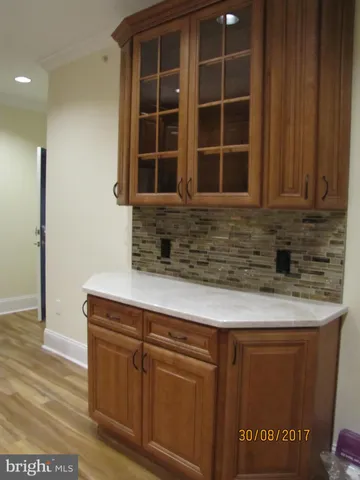 a kitchen with granite countertop cabinets and window