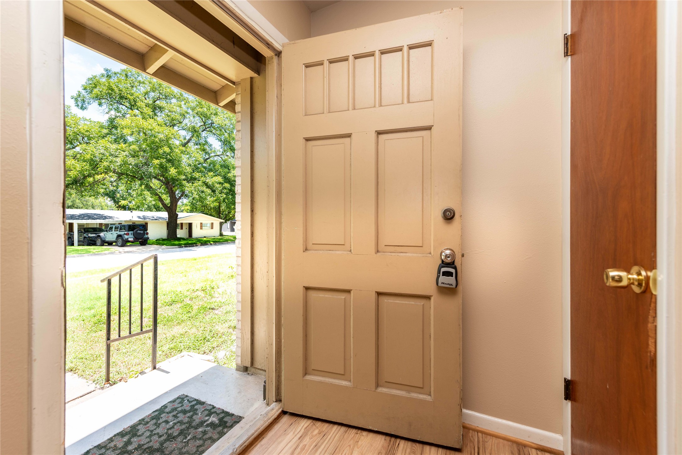 7602 Delafield Lane Austin, TX 78752 - Photo 3 of 17 Step through the welcoming front door to a view of the peaceful, tree-lined neighborhood.