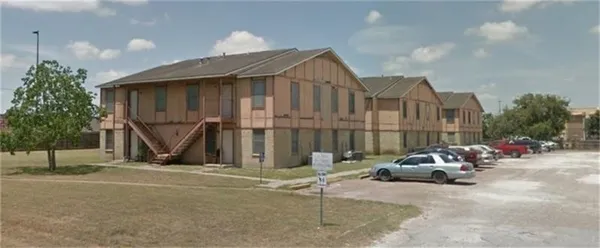 a view of a car park in front of house
