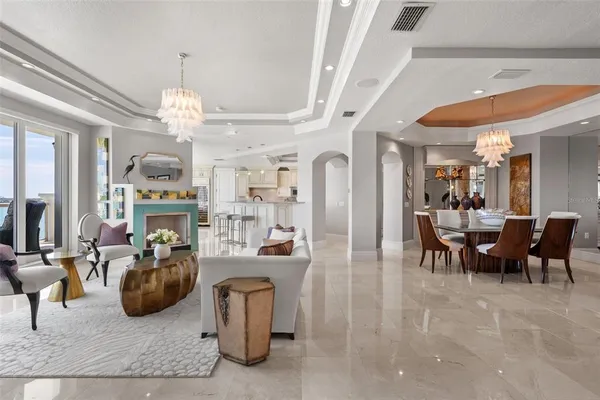 a kitchen with granite countertop a sink stainless steel appliances and white cabinets
