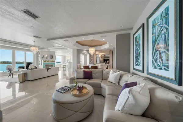 a kitchen with stainless steel appliances granite countertop white cabinets and a stove a oven with granite countertops