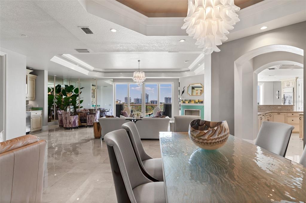 464 Golden Gate Point, Unit 703 Sarasota, FL 34236 - Photo 25 of 88 a living room with furniture and a chandelier