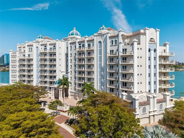 a view of a lake with tall building