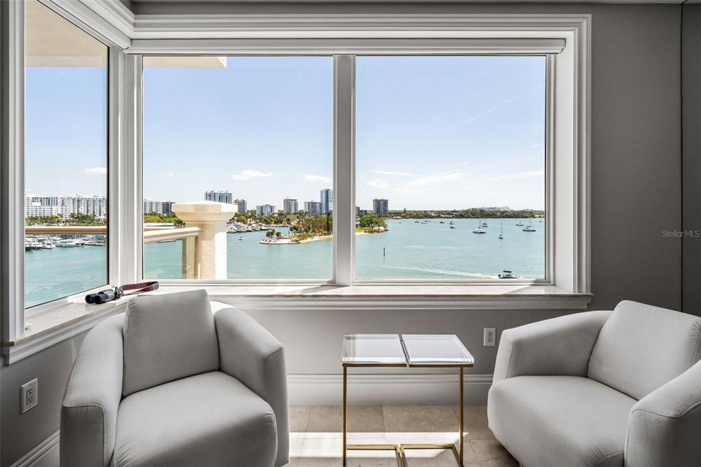 464 Golden Gate Point, Unit 703 Sarasota, FL 34236 - Photo 34 of 88 a living room with furniture and a large window