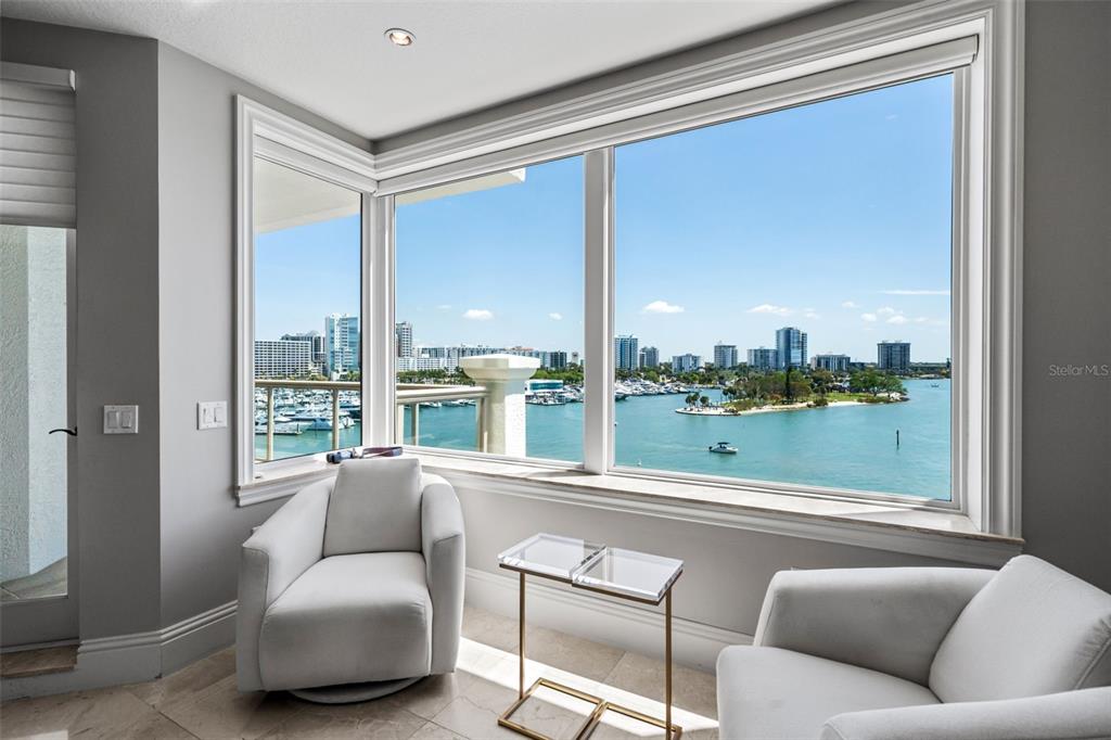 464 Golden Gate Point, Unit 703 Sarasota, FL 34236 - Photo 35 of 88 a living room with furniture city view and large windows