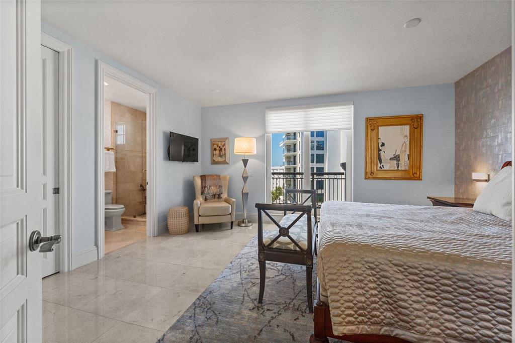 464 Golden Gate Point, Unit 703 Sarasota, FL 34236 - Photo 61 of 88 a bedroom with furniture and a window