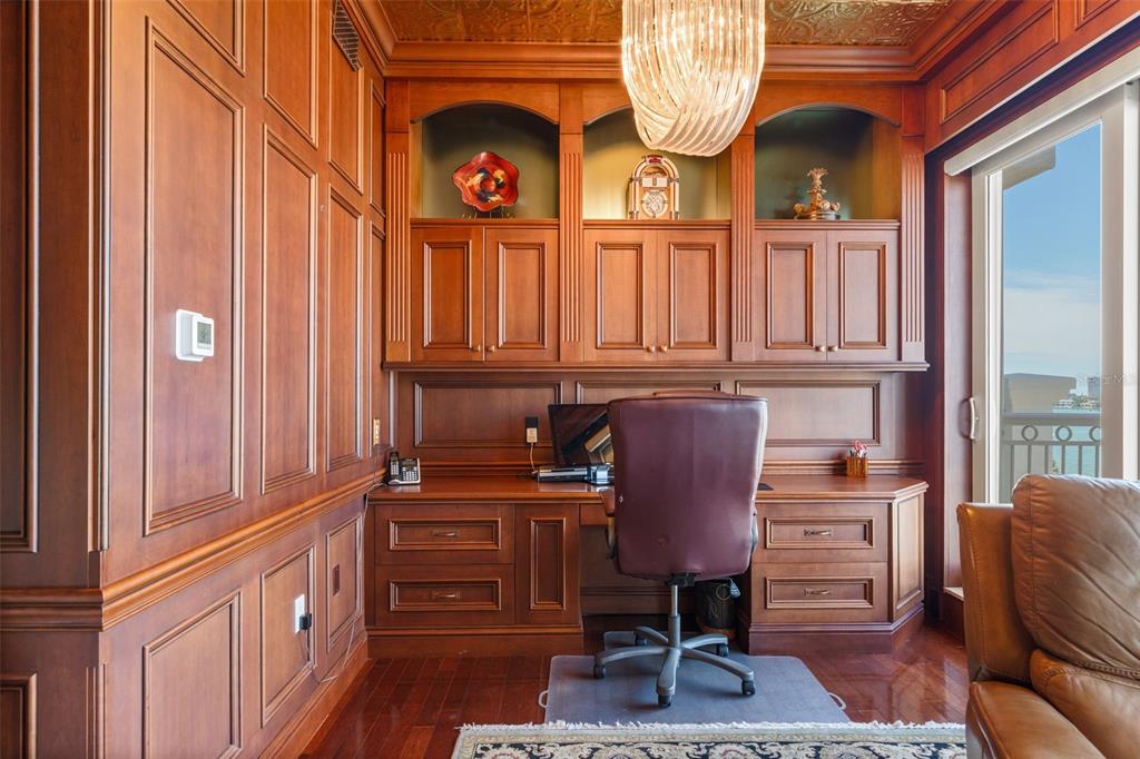 464 Golden Gate Point, Unit 703 Sarasota, FL 34236 - Photo 68 of 88 a view of a chair and table in a kitchen