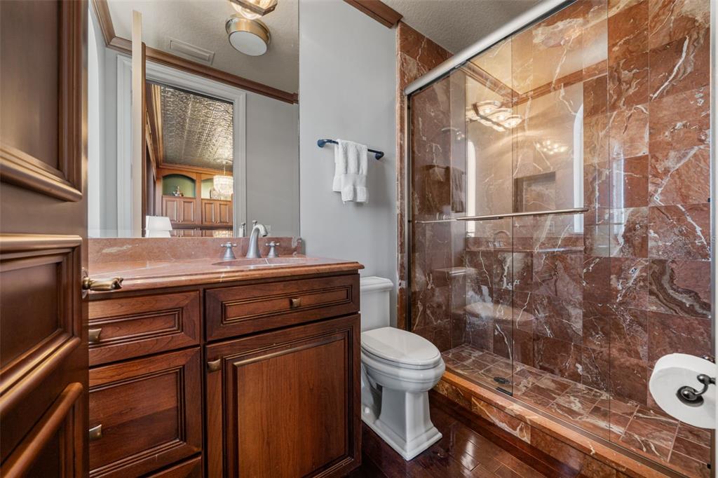 464 Golden Gate Point, Unit 703 Sarasota, FL 34236 - Photo 70 of 88 a bathroom with a sink a toilet and shower