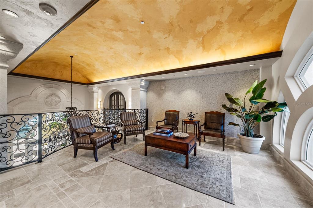 464 Golden Gate Point, Unit 703 Sarasota, FL 34236 - Photo 79 of 88 a backyard of a house with table and chairs