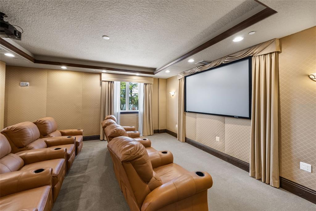 464 Golden Gate Point, Unit 703 Sarasota, FL 34236 - Photo 80 of 88 a living room with furniture and a flat screen tv