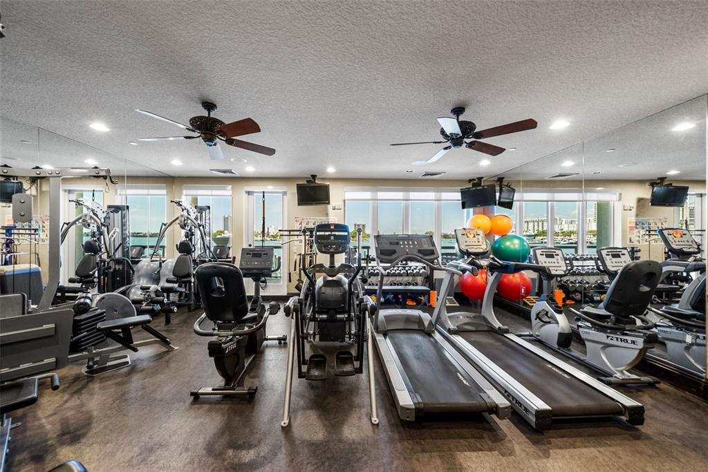 464 Golden Gate Point, Unit 703 Sarasota, FL 34236 - Photo 83 of 88 a view of a room with gym equipment