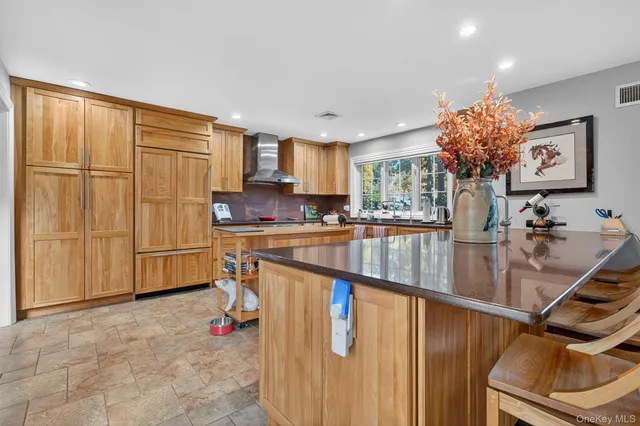 a kitchen with stainless steel appliances granite countertop a granite counter tops and a refrigerator