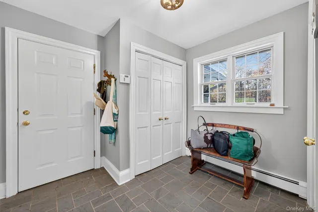 a bedroom with a bed and a flat screen television