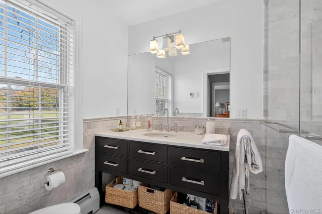 a bathroom with a bathtub and shower
