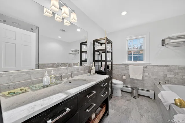 a bathroom with a bathtub and shower