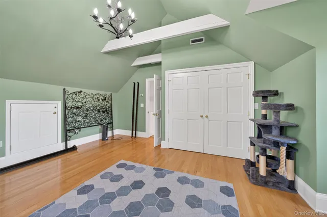 a room with gym equipment and a view of living room