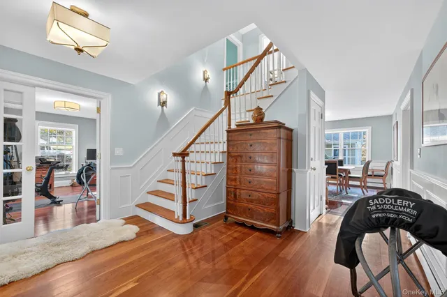 a view of a livingroom with furniture and staircase