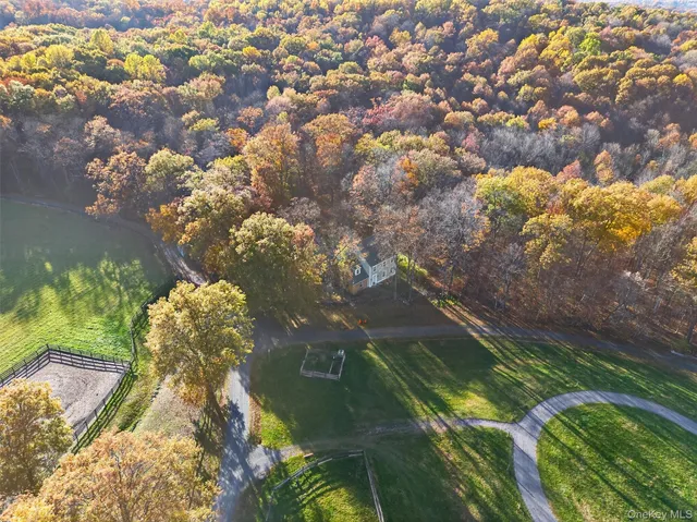 an aerial view of residential house and outdoor space