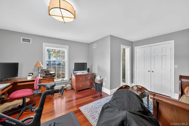a bedroom with furniture and a window