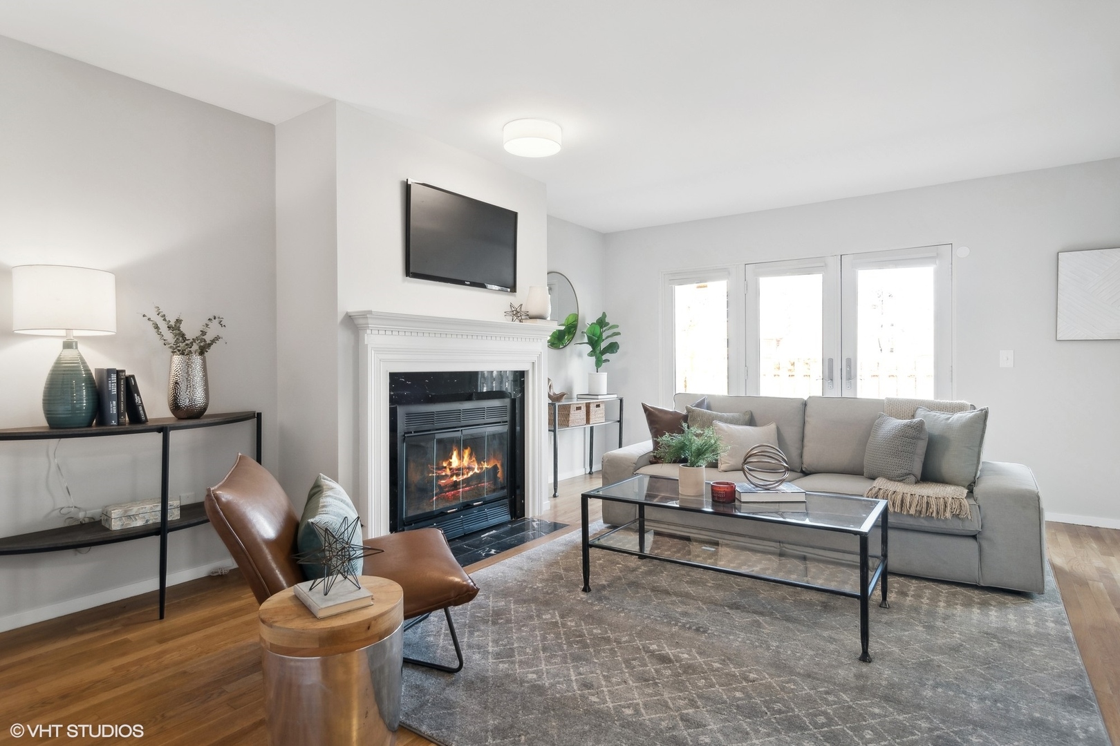 844 South Morgan Street Chicago, IL 60607 - Photo 2 of 10 a living room with furniture a fireplace and a flat screen tv