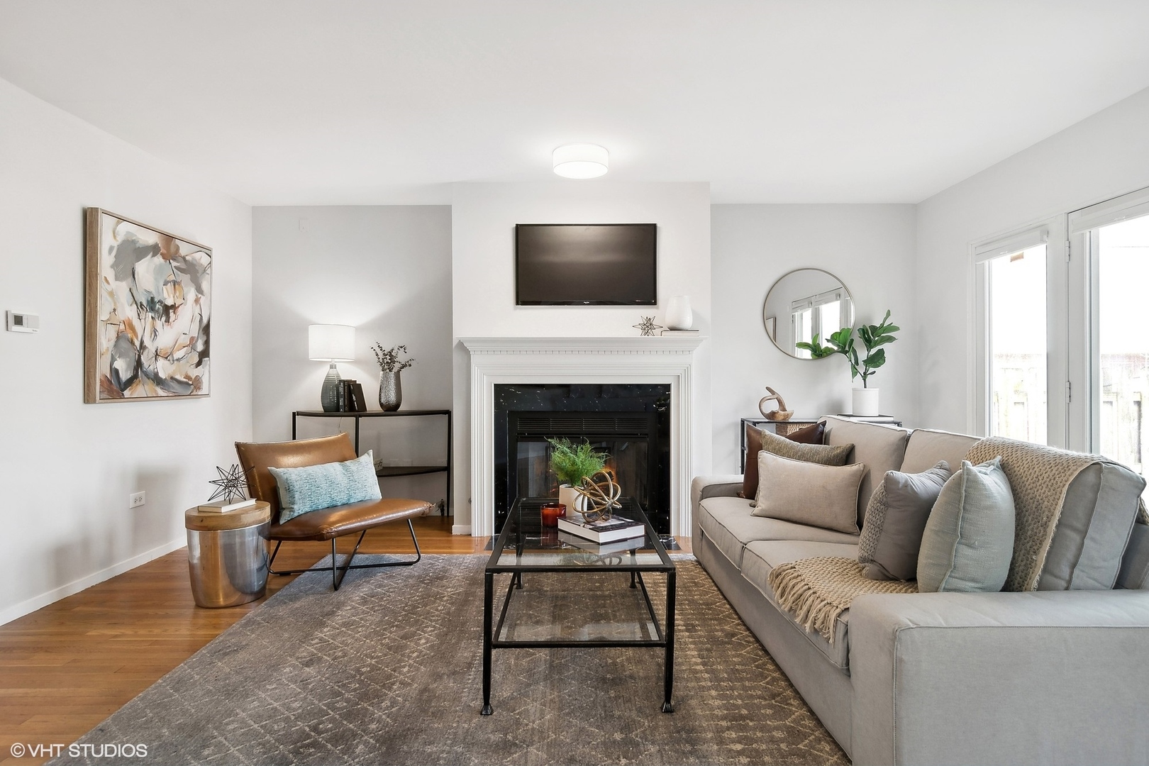 844 South Morgan Street Chicago, IL 60607 - Photo 3 of 10 a living room with furniture a flat screen tv and a fireplace