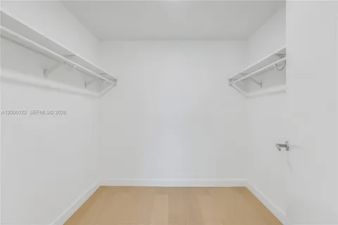 a utility room with sink dryer and washer