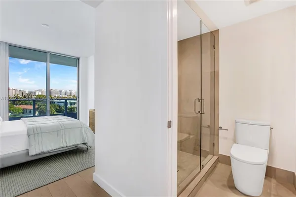 a view of an empty room with a balcony