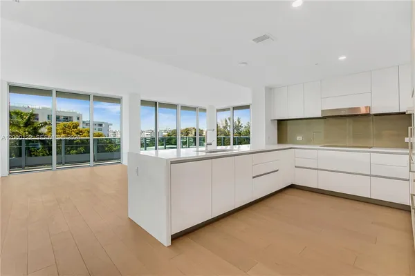 a view of a swimming pool with lawn chairs