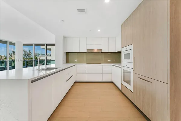 a view of a swimming pool with a lounge chair